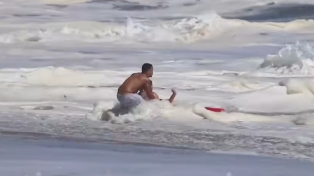 teen lifeguard saves child from waves