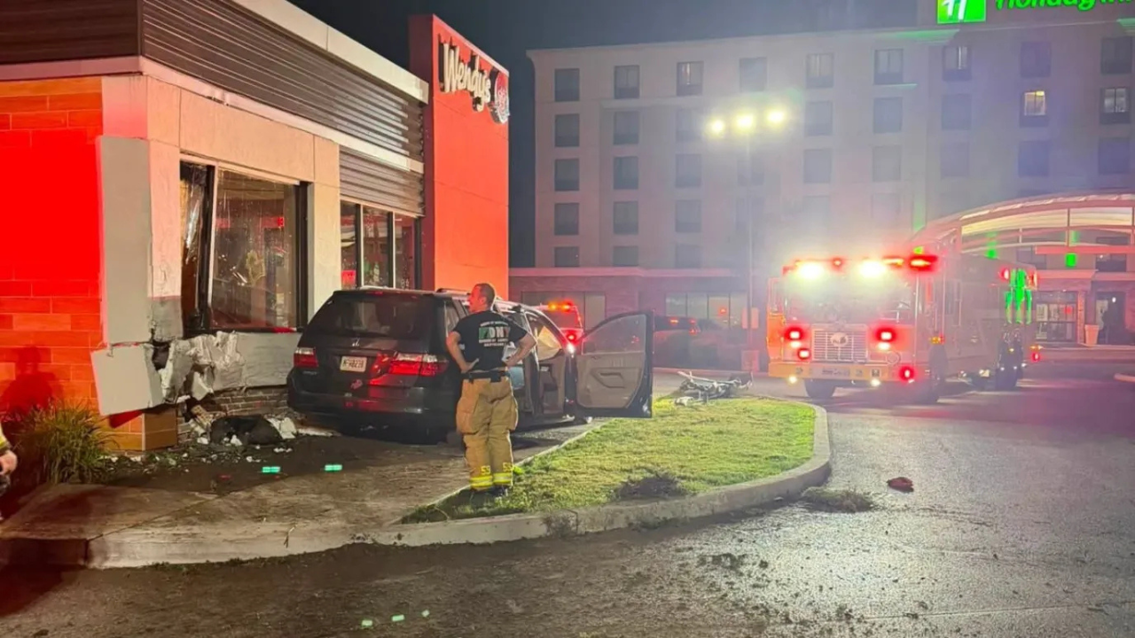 car crashes into wendys