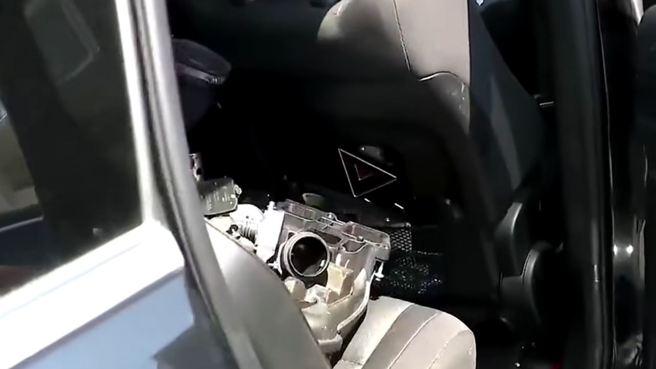 engine in back of car after maintenance