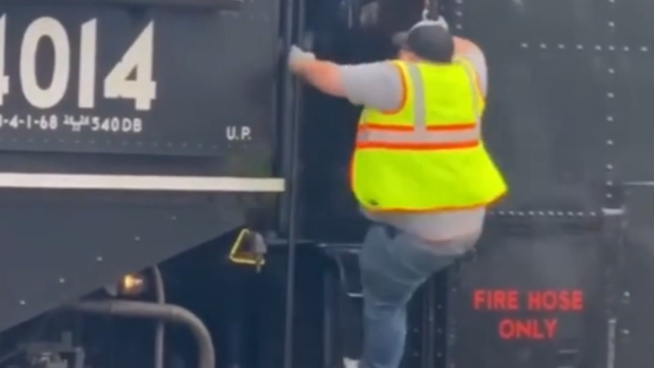 man falls off big boy train