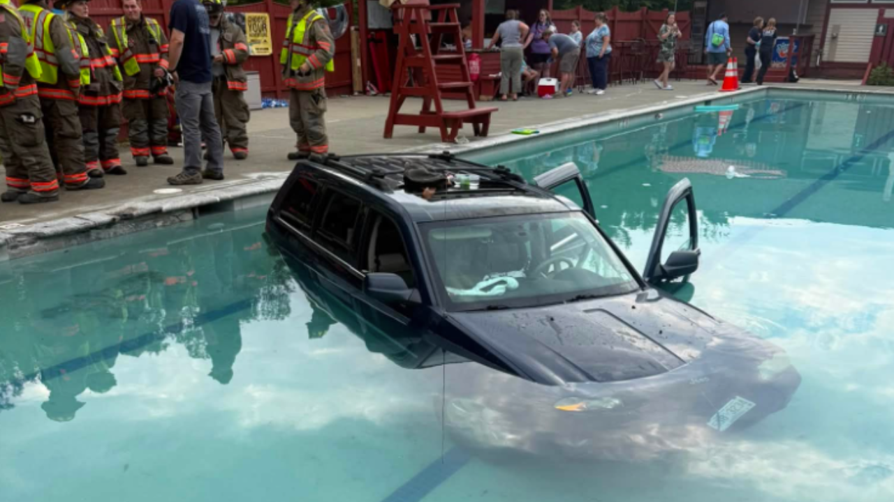 suv lands in pool at resort