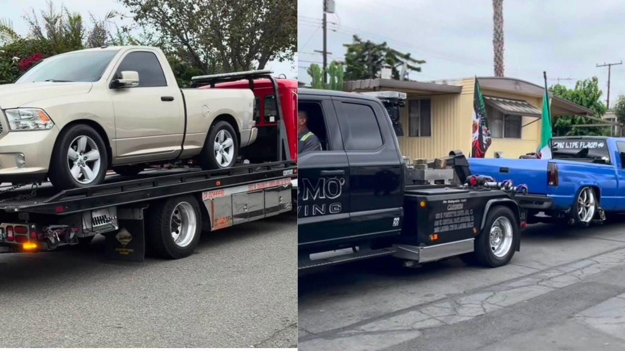 Two pickup trucks are loaded onto tow trucks after Santa Ana Police impounded the vehicles following alleged burnout exhibitions after a World Cup celebration.