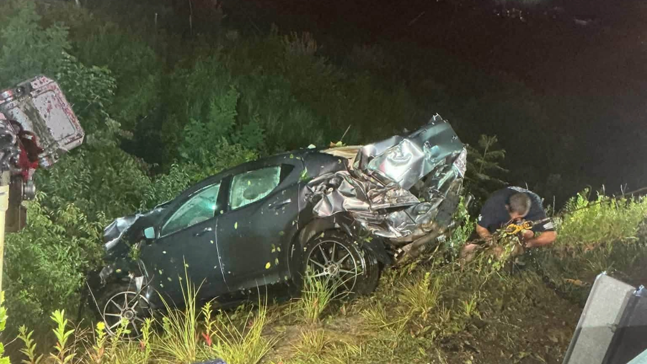 Three Escape After Vehicle Plunges 70 Feet Down Interstate Embankment