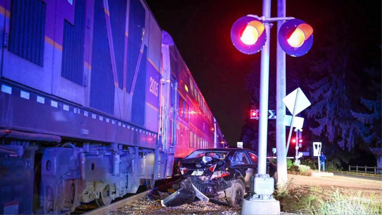 Driver Escapes Before Commuter Train Smashes Into Car on Tracks