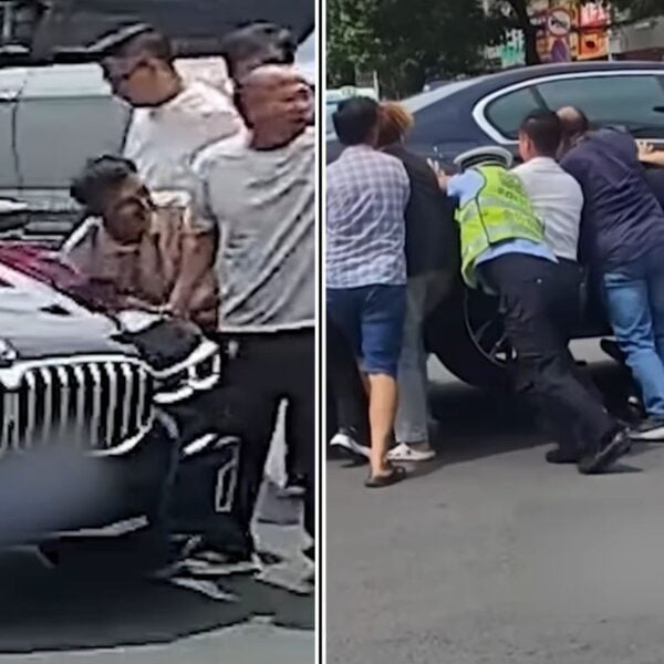 Dozens of Strangers Turn Into Heroes After Biker Gets Pinned Under BMW In Viral Video