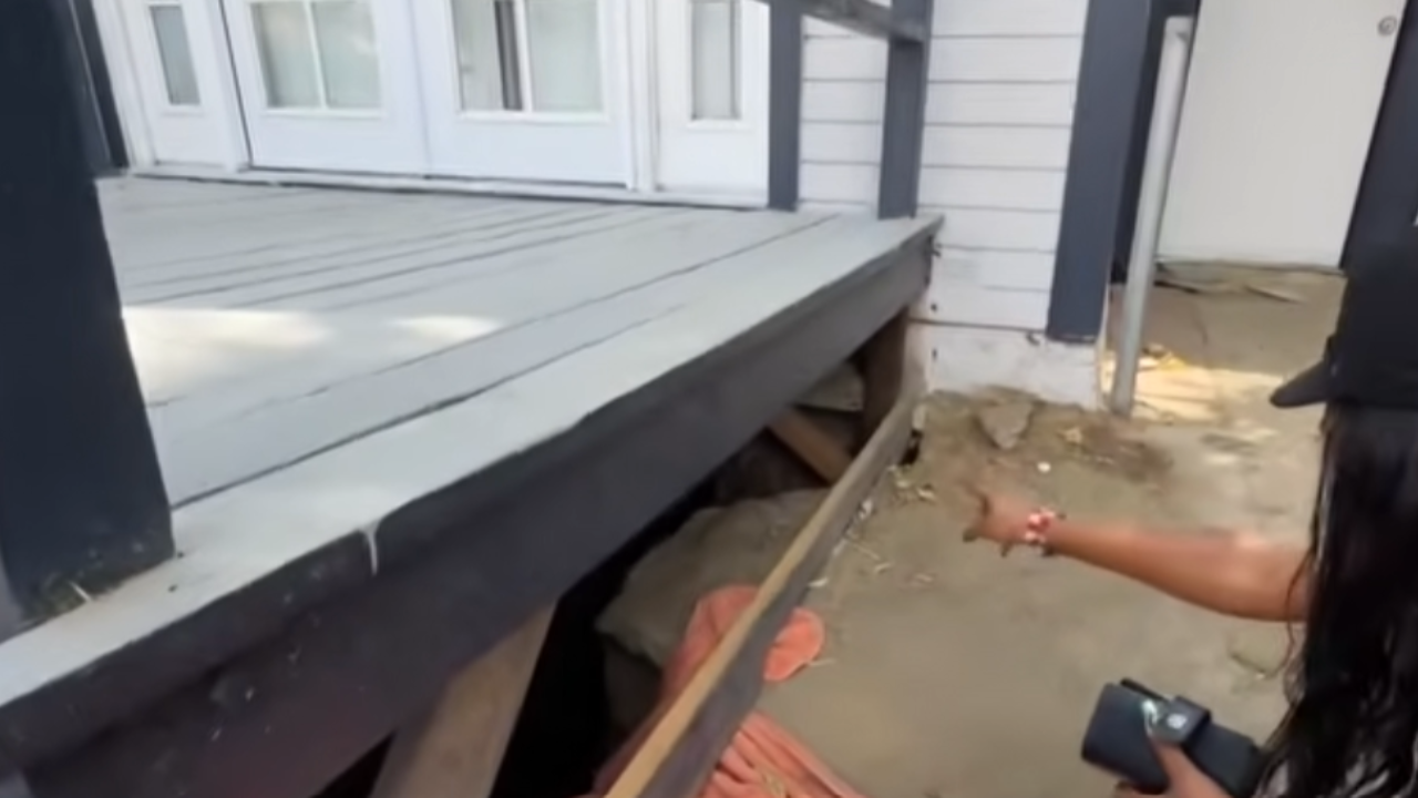 man living under family's porch