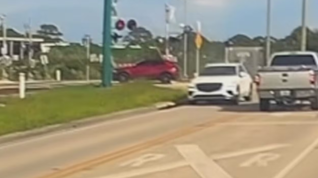 florida man saves driver on tracks