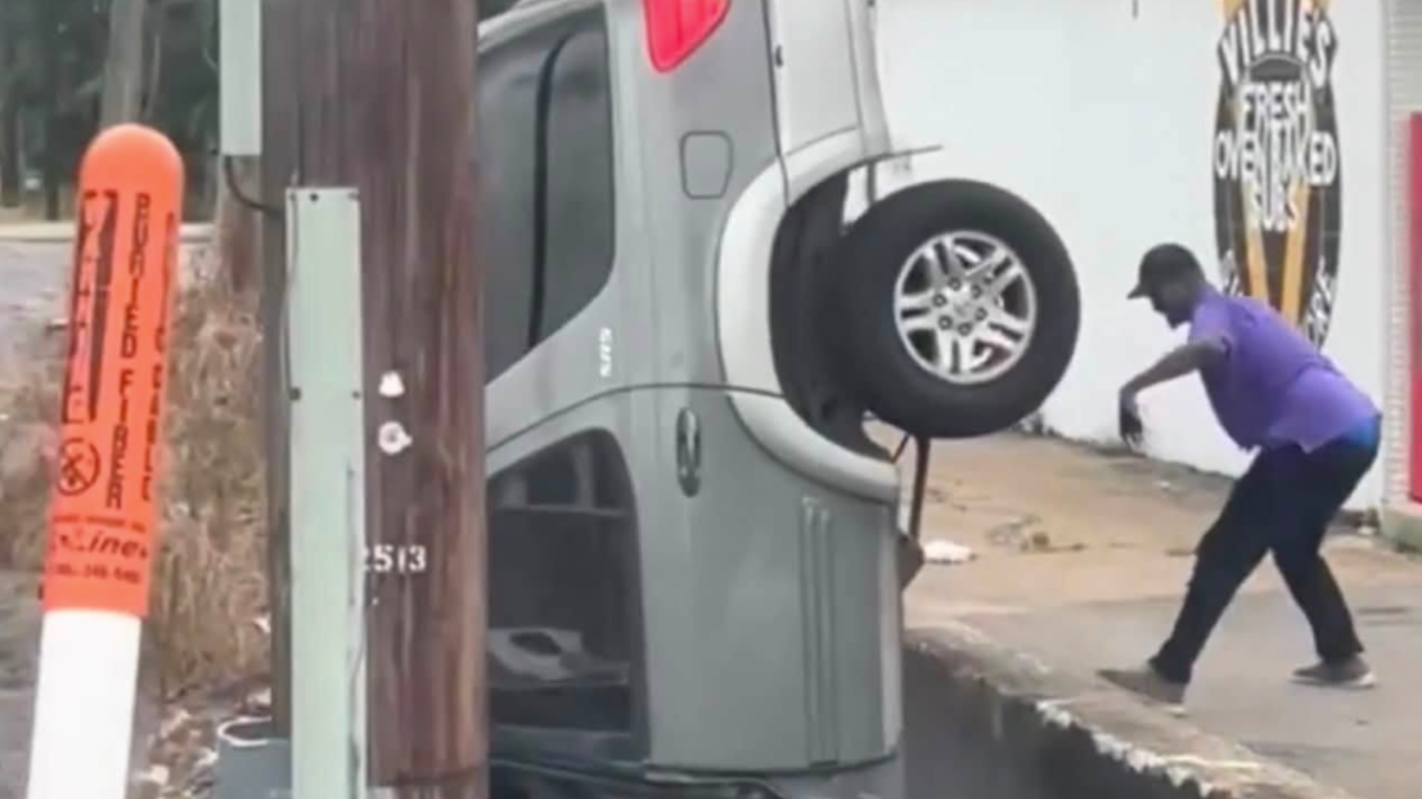 SUV falling off ledge