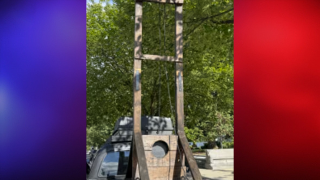 man arrested guillotine in car