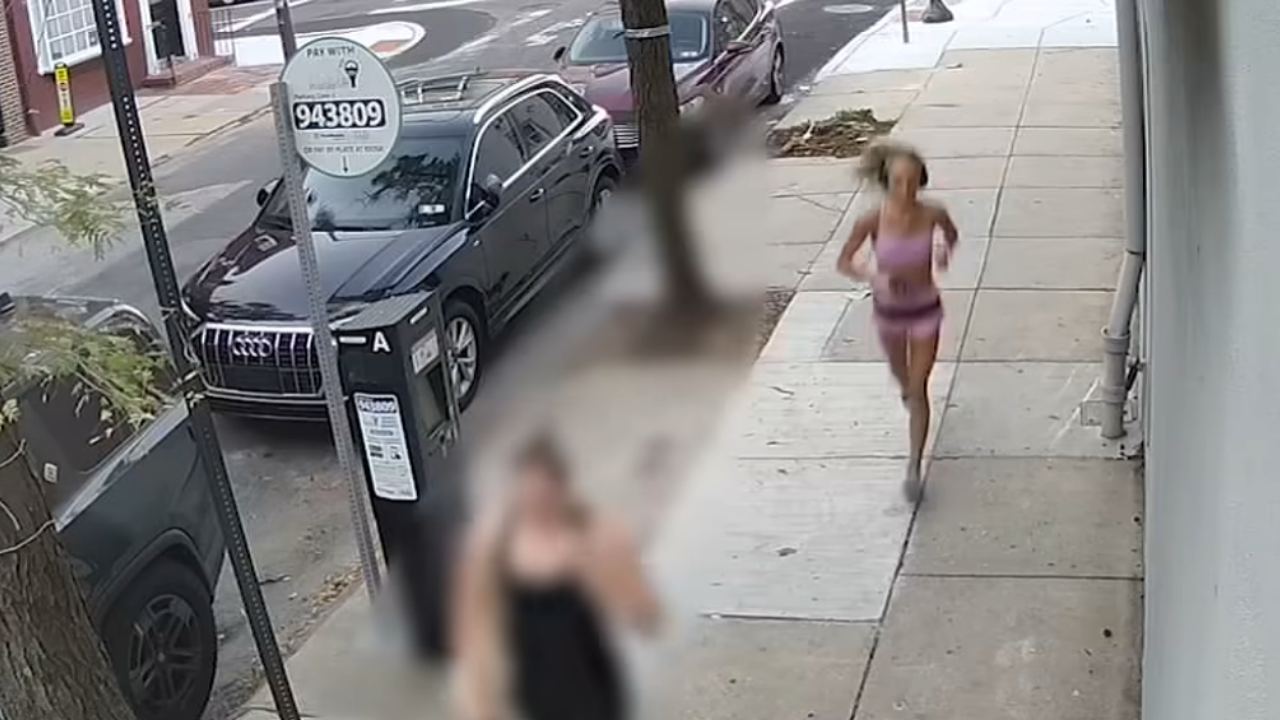 man tries to kick jogging woman