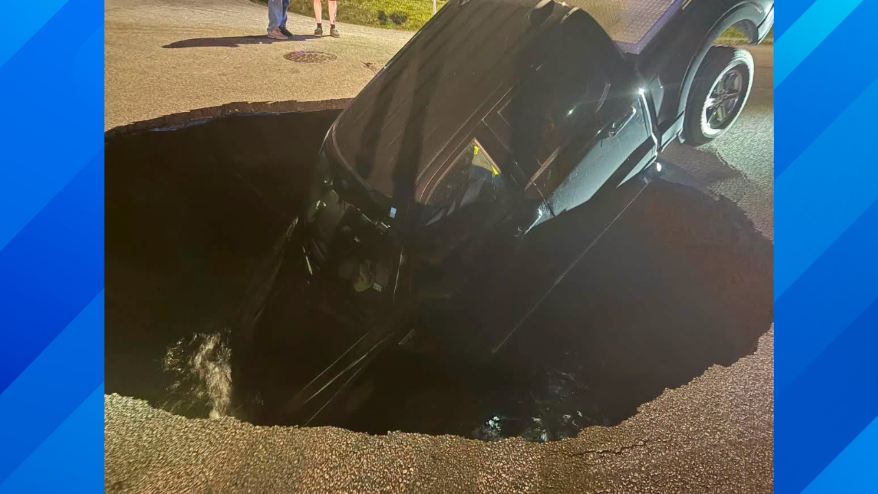 pickup truck f-150 in sink hole