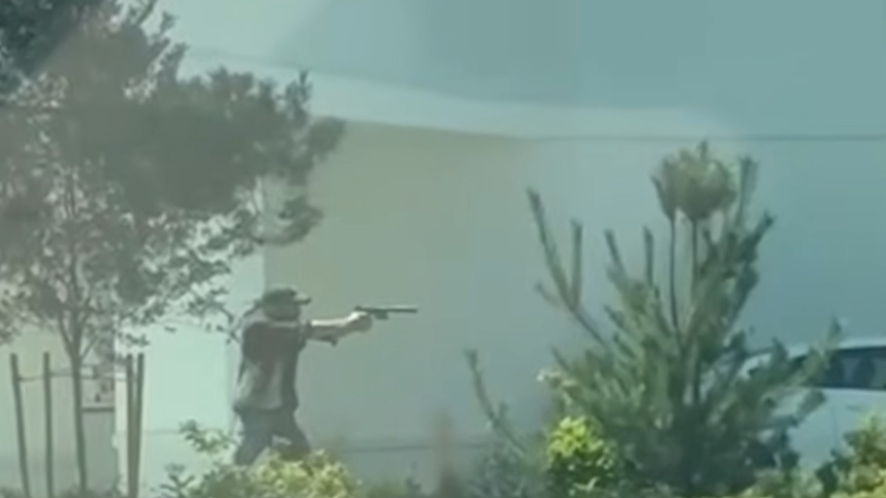 man with gun stops active shooter