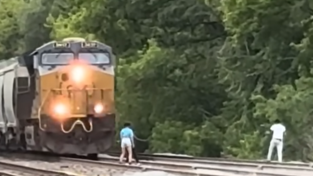 kids jump in front of train