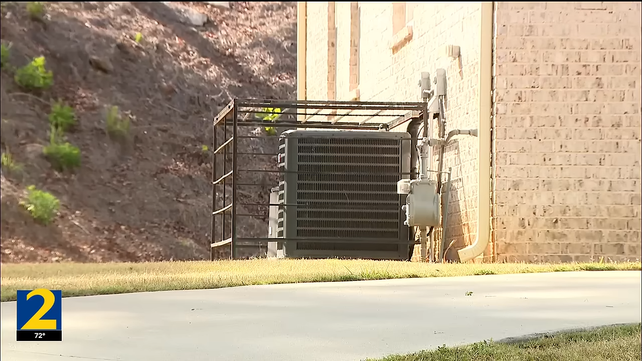 AC in metal cage against theft