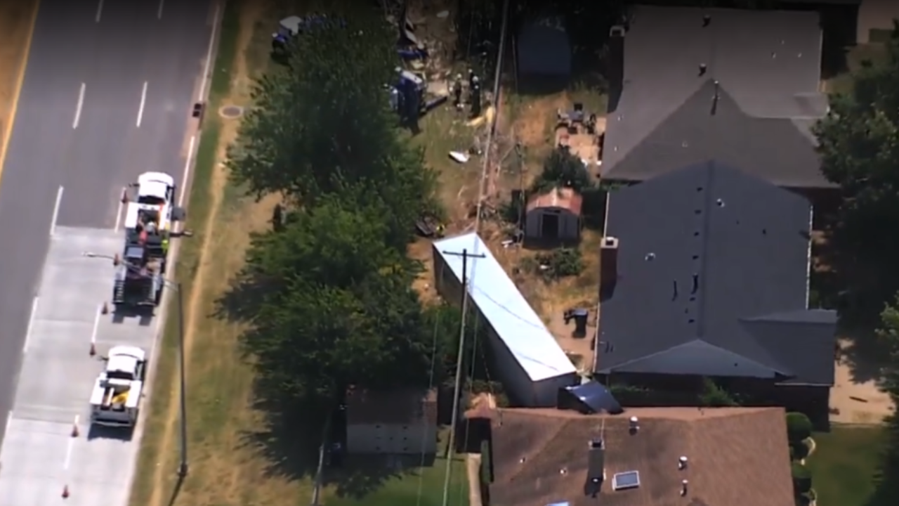 semi truck hits house