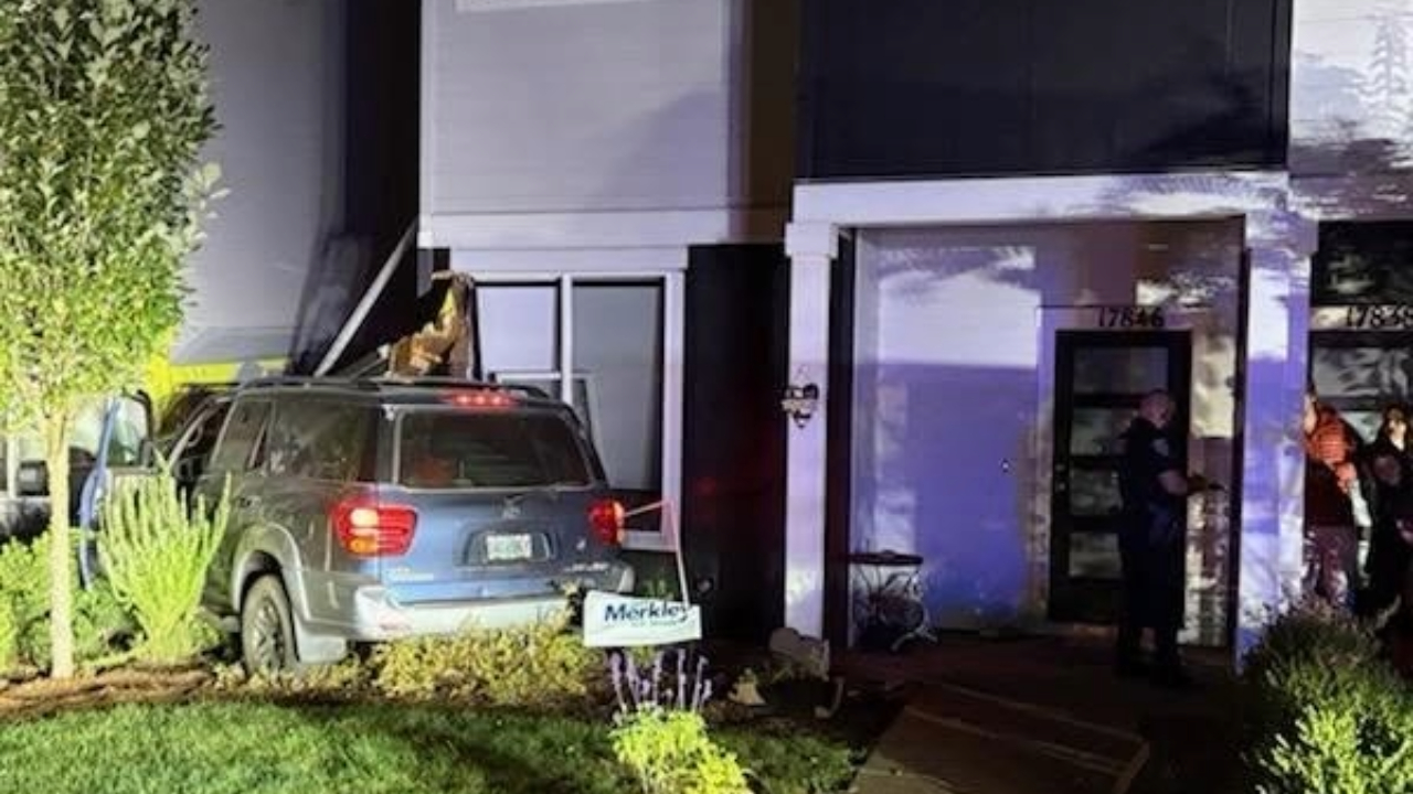 Teen crashes into townhouses