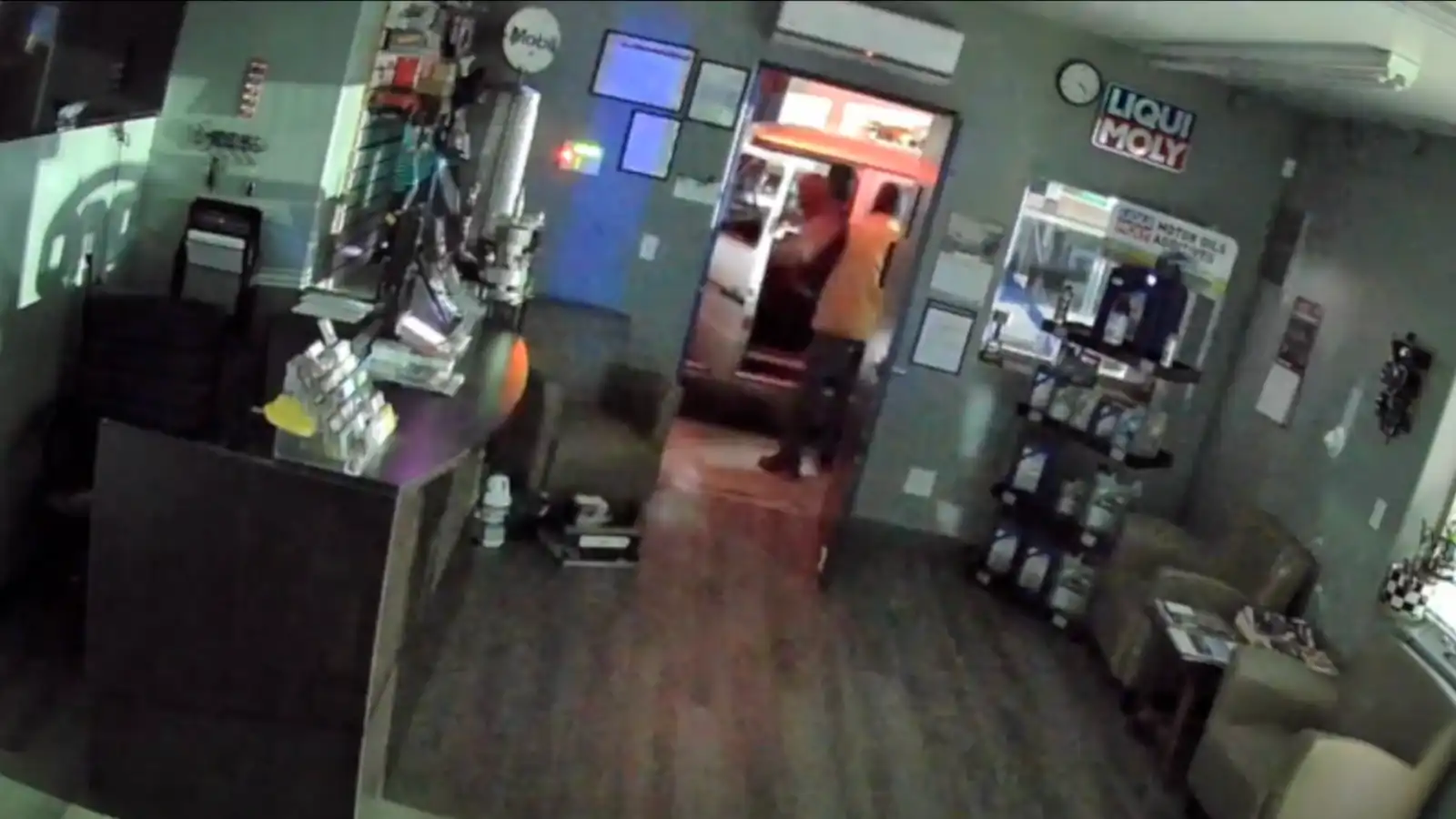 two people inside a repair shop